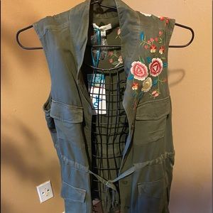 Army green vest with a floral detail